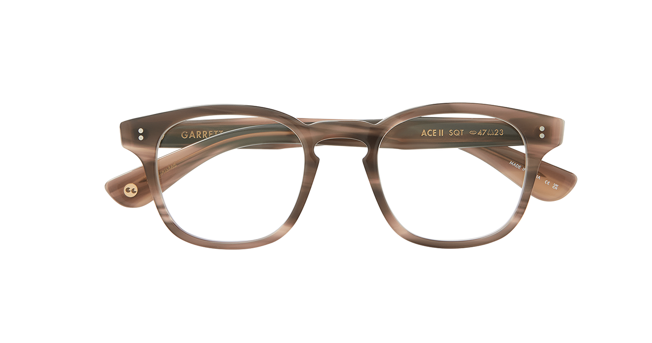 Our cult-favorite Ace Sun transformed into an optical. Ace II reflects the standard way in which we design and create premium eyewear. We’re not reinventing the wheel here – just putting some rims on ‘em. In Sequoia Tortoise, an ashy light brown tortoise shell like pattern. This image shows the frame with the arms folded..