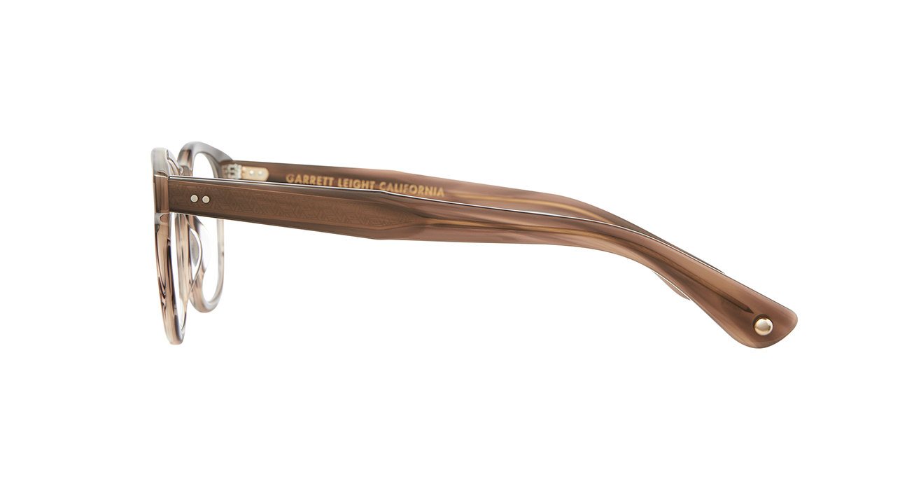 Our cult-favorite Ace Sun transformed into an optical. Ace II reflects the standard way in which we design and create premium eyewear. We’re not reinventing the wheel here – just putting some rims on ‘em. In Sequoia Tortoise, an ashy light brown tortoise shell like pattern. This image shows the complete sideview of the frame.