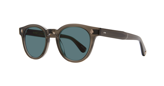 Sunglasses with dark lenses and brown frame on a white background