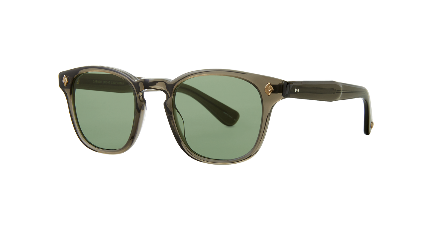 With bold lines and fine details, the Ace sunglass is for the strong and not-so-silent types. Featuring a palm leaf plaque adorning the frame front and glass lenses for unmatched clarity, the Ace is a striking choice for the discerning wearer.