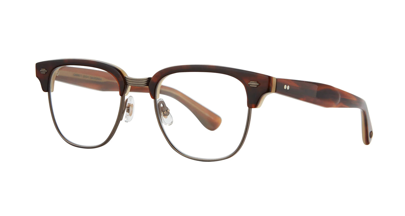 Vintage with modern sophistication—the Elkgrove eyeglass frame combines a unique browline, a deep square lens shape made from biodegradable acetate and a larger fit for those with bolder tastes.  It features contoured temples inspired by 50s car fins and is finished with our distinctive metal plaques.