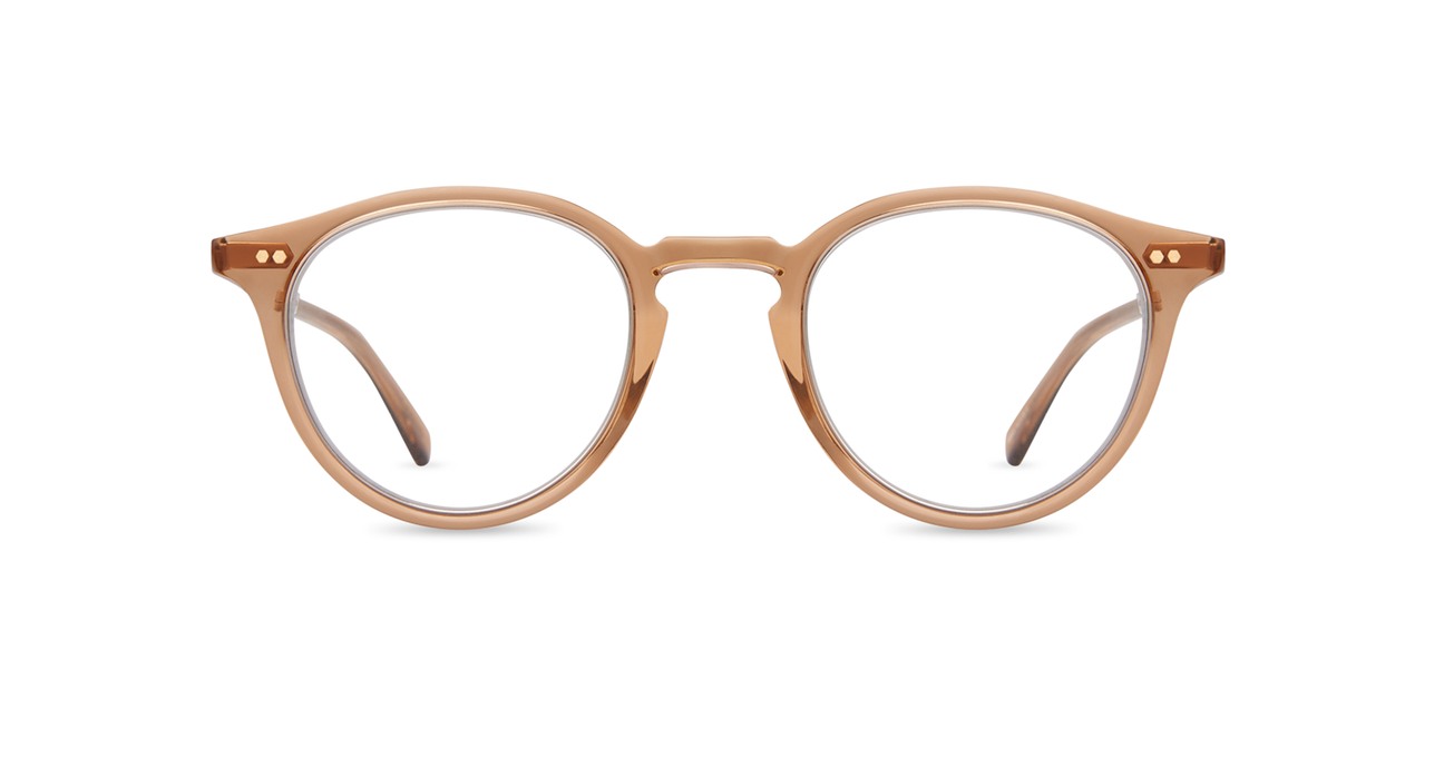 Inspired by the Golden Age of Hollywood, our classic Pantoscopic “P3” eyeglass style is updated in new colors. Exposed coil temples made from beta-titanium add strength, flexibility and fit. Accents like the titanium bridge and titanium inside eyewire provide a dash of sophistication.  Delicate filigree artwork adorns the titanium temples, which are seamlessly embedded in premium acetate.